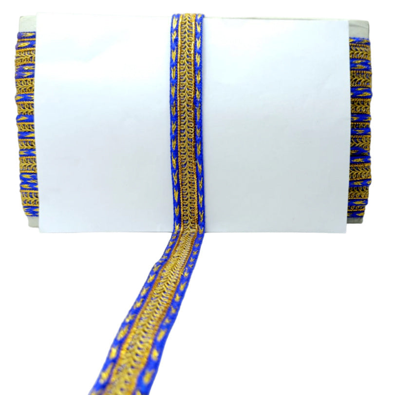 Decorative ribbon with blue and gold pattern on a white background