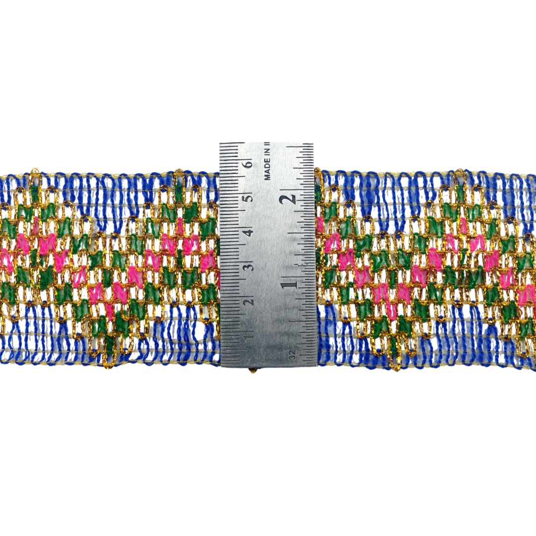 Multicolored beaded trim with a ruler for scale on a white background