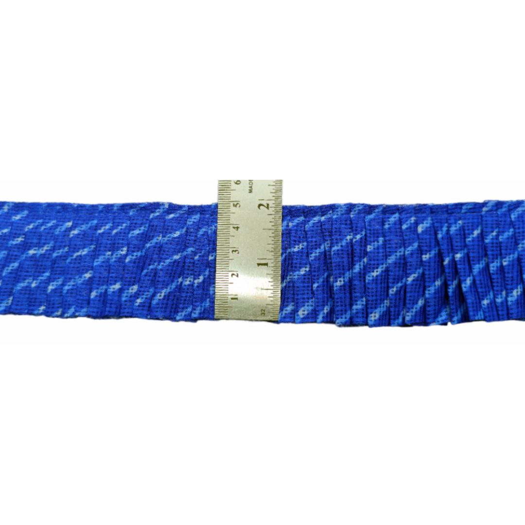 Blue rope with a metal ruler for scale on a white background