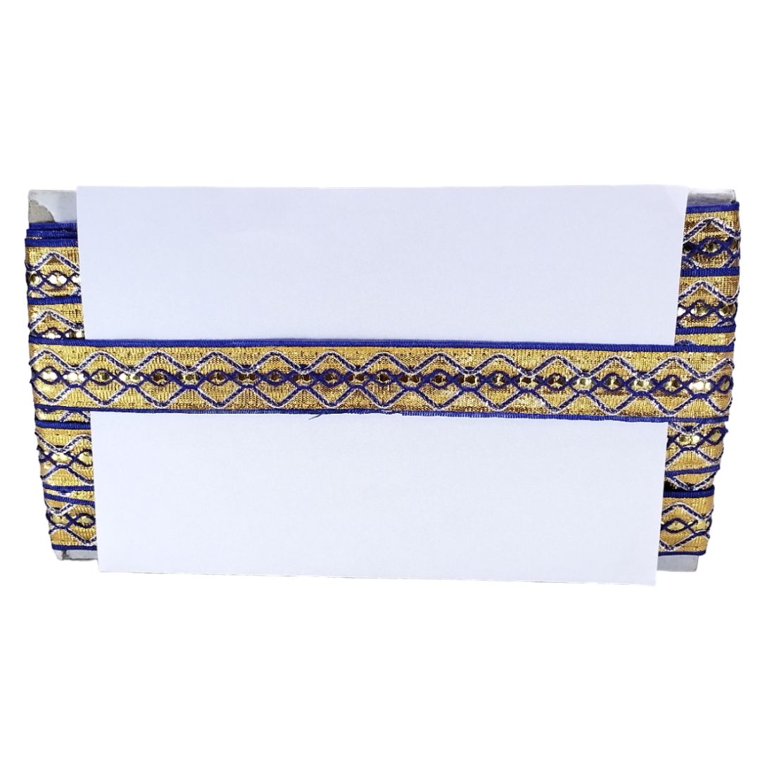White tablecloth with blue and gold decorative trim on a white background