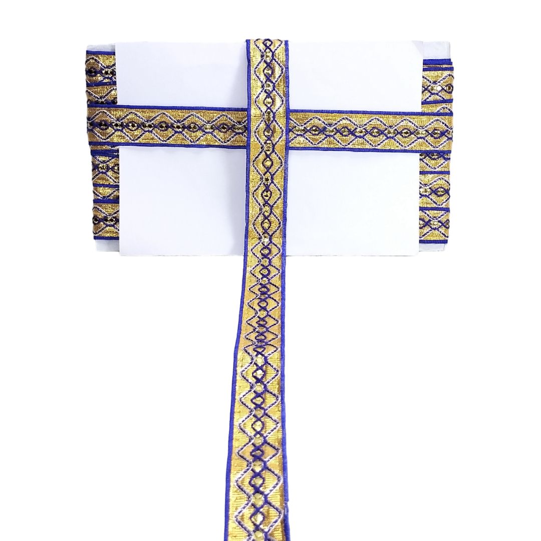Decorative cross with blue and gold patterns on a white background