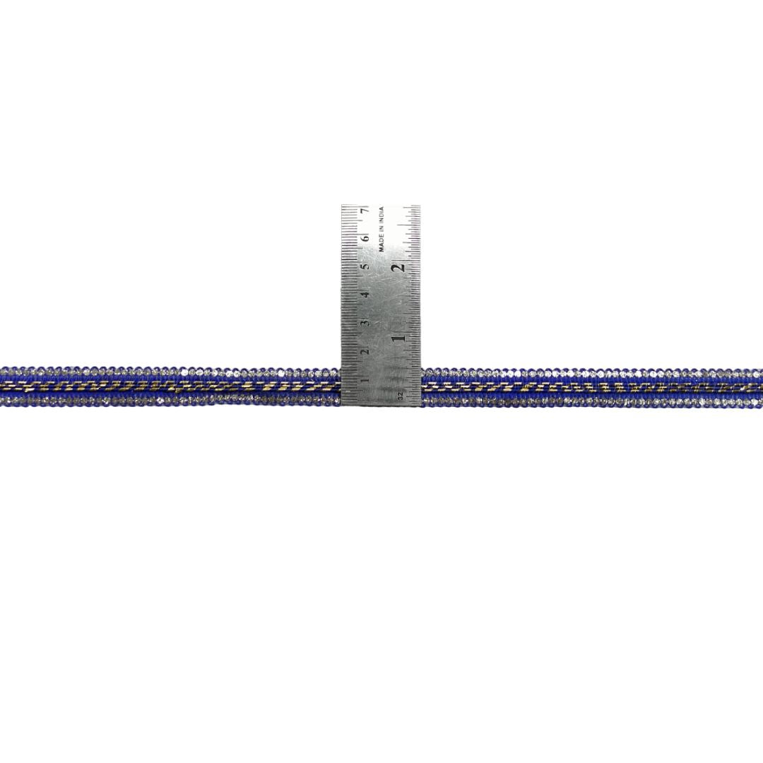 Metallic blue and gold braided cable with a ruler for scale on a white background
