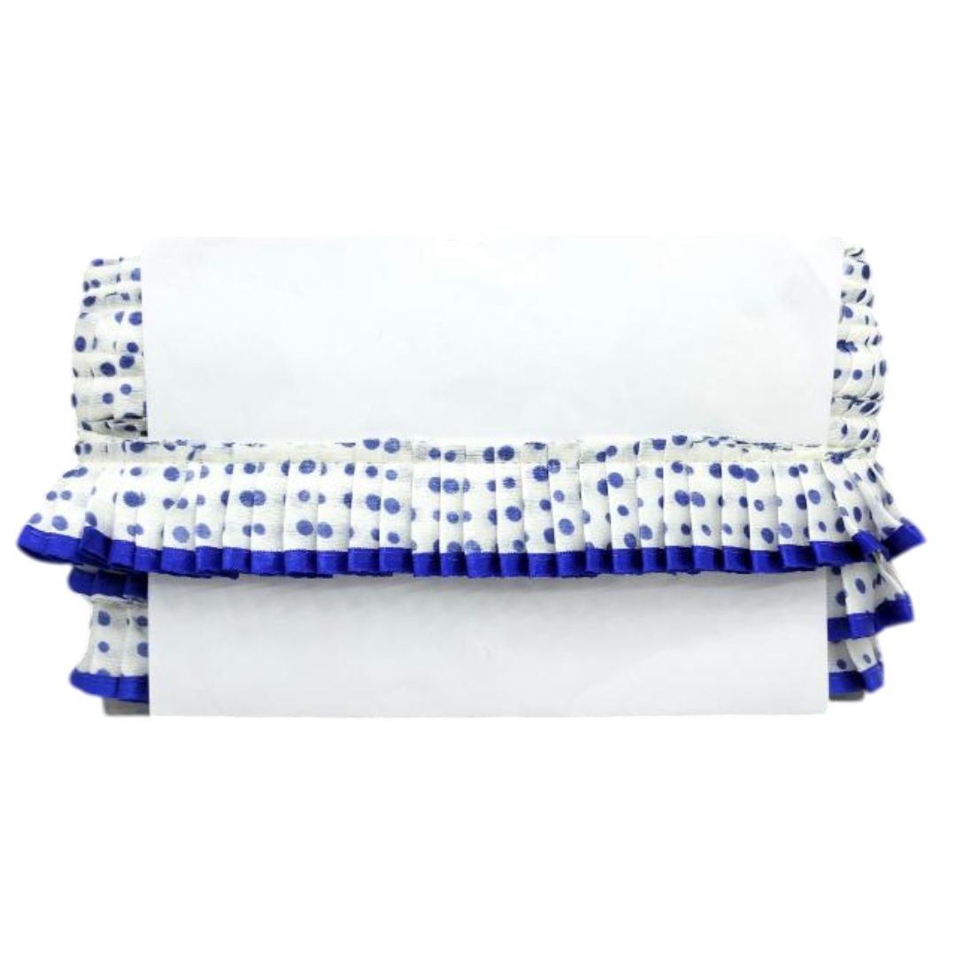 White air conditioner cover with blue polka dot ruffles on a white background