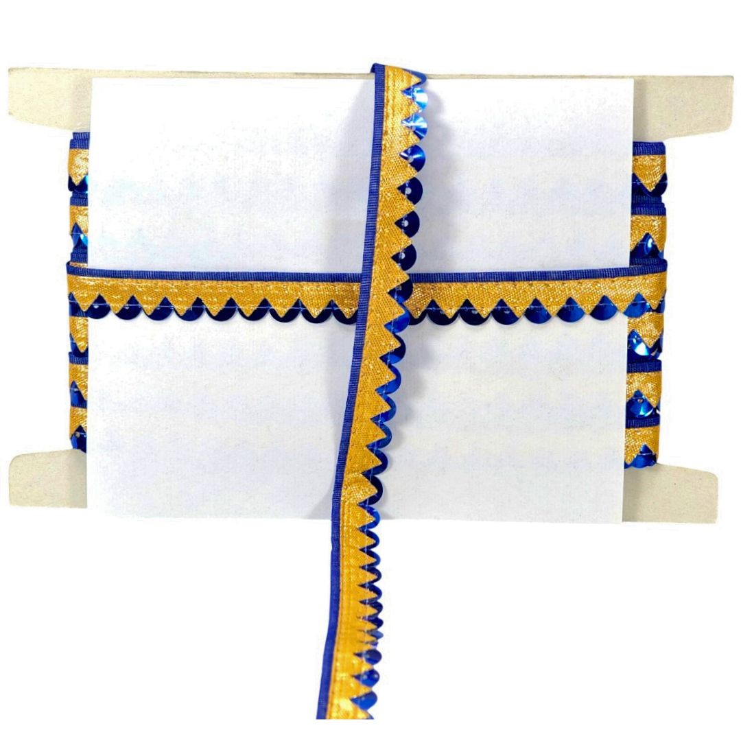 Decorative white towel with blue and yellow border on a wooden rack