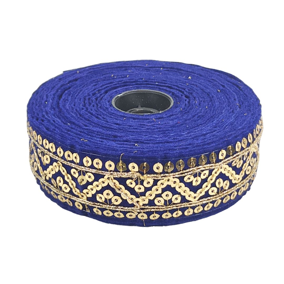 Roll of blue ribbon with gold decorative trim on a white background
