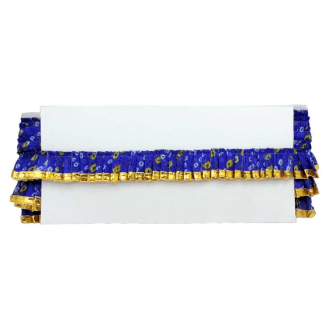 White pillow with blue and gold ruffled trim on a white background