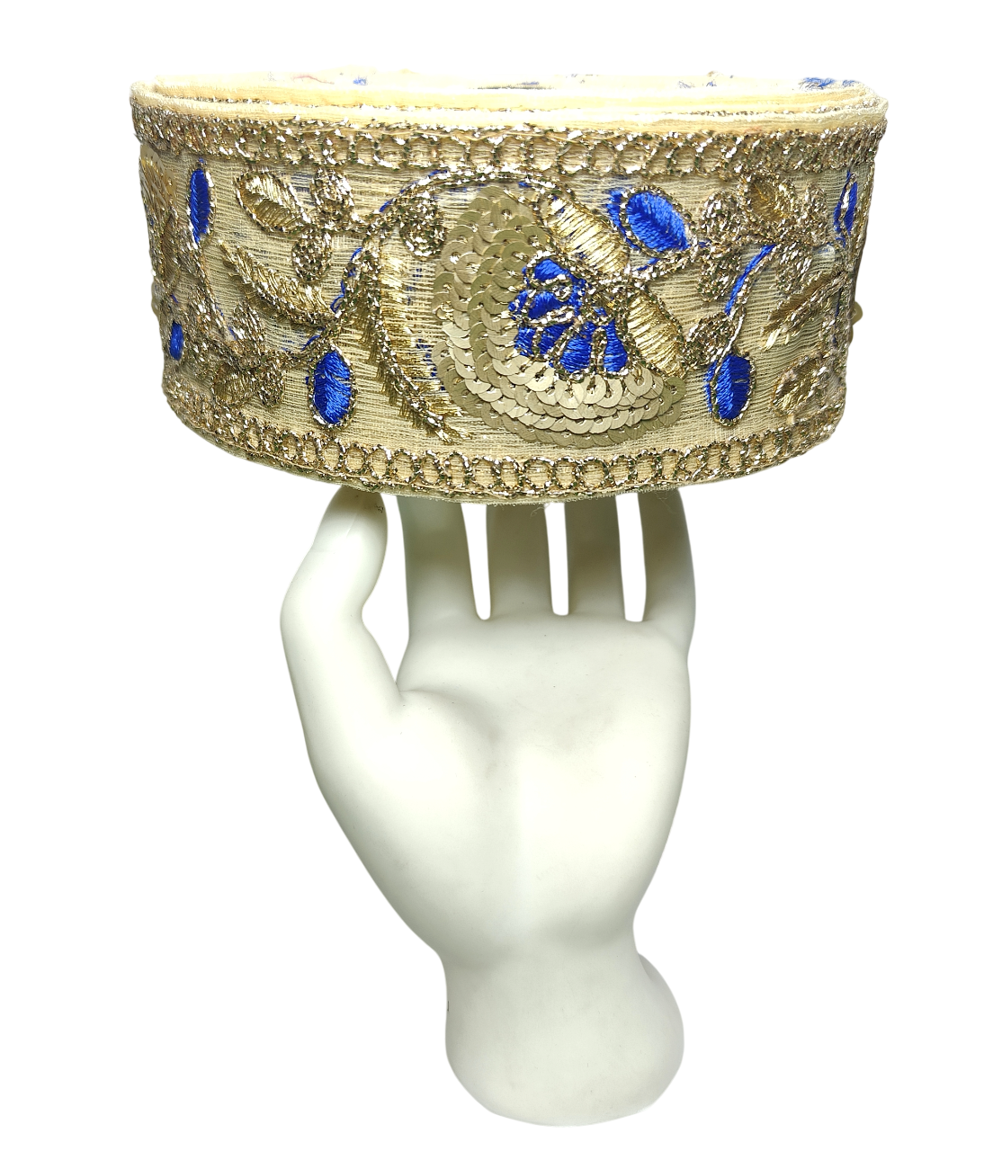 Decorative headband with blue stones on a white mannequin head