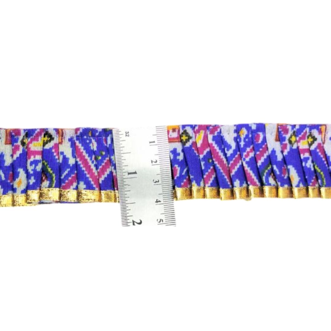 Multicolored fabric trim with a ruler for measurement on a white background