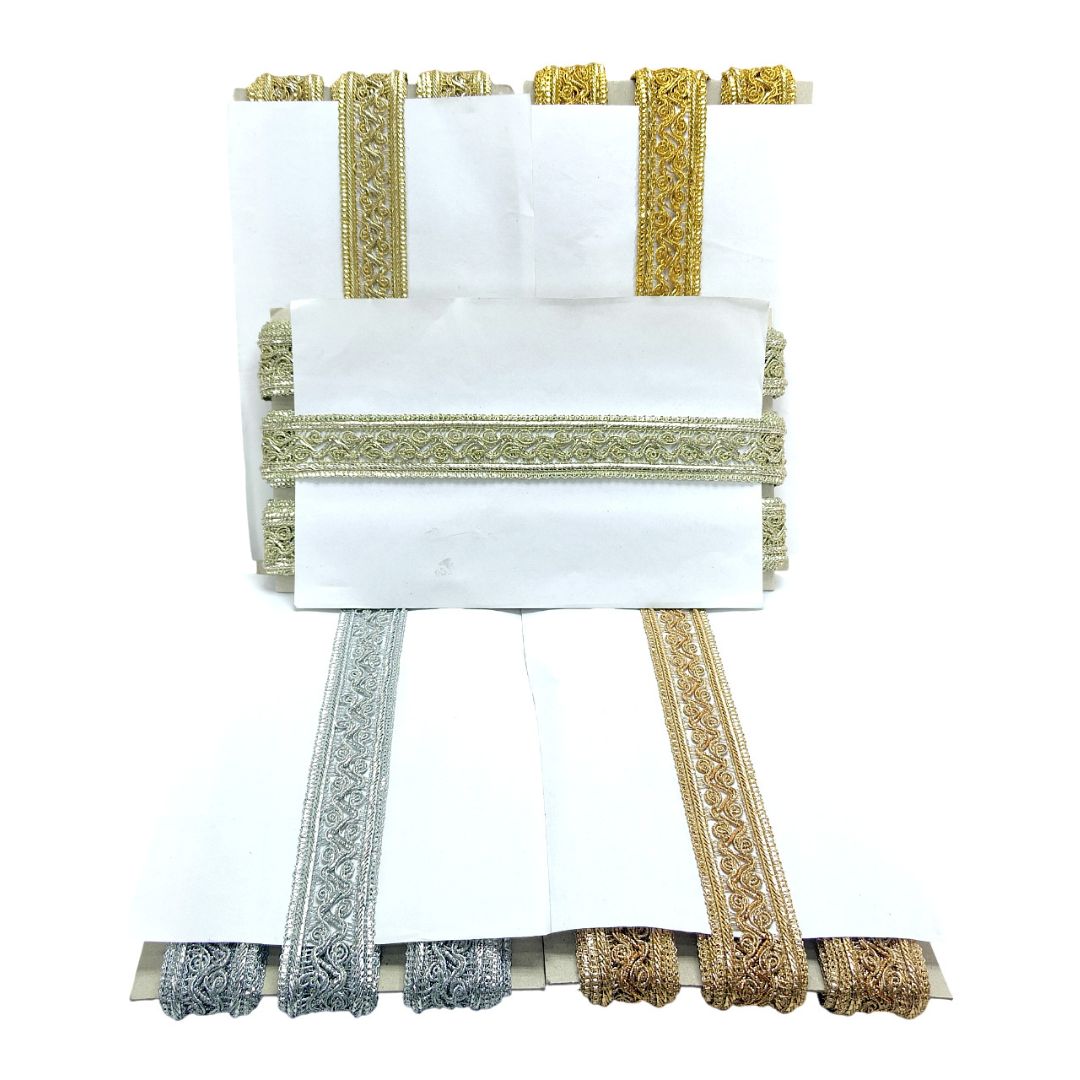 White saree with gold and silver border on a white background