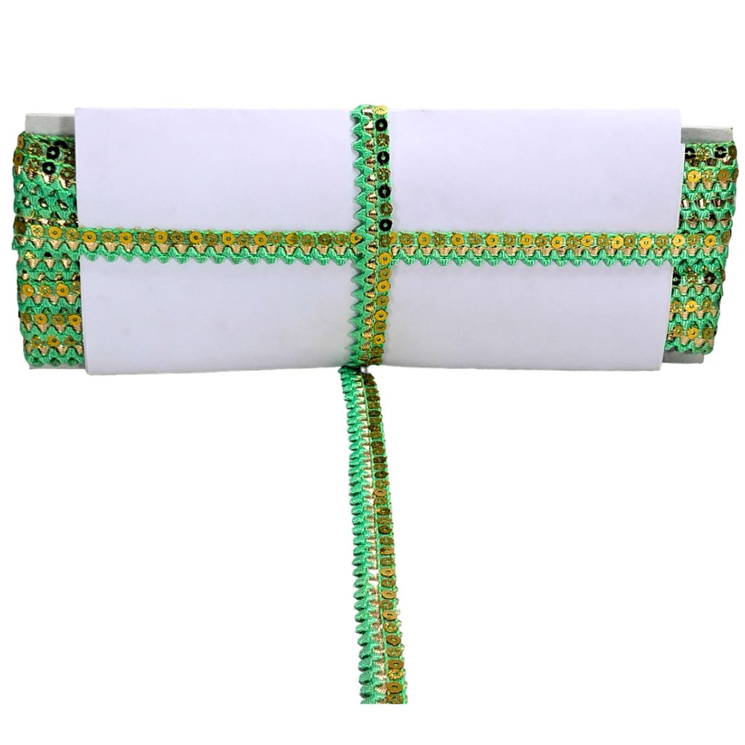 White clutch with green and gold decorative trim on a white background