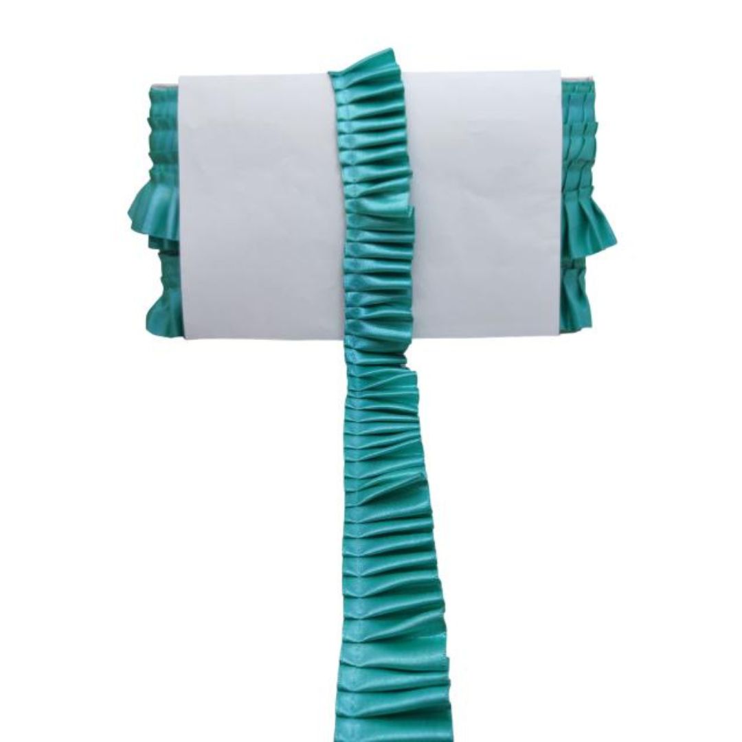 Teal ruffled table runner on a white background