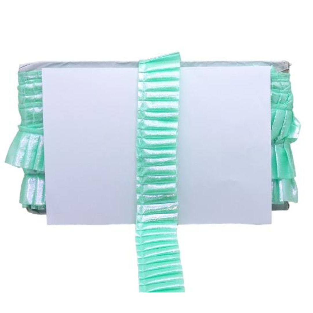 Green ribbons with a white card on a white background