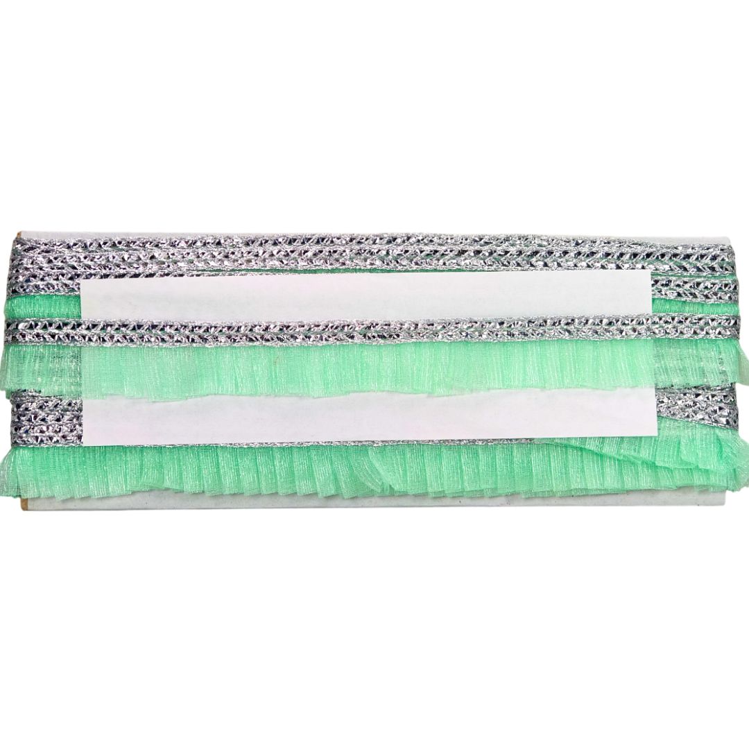 Stack of green and gray cleaning cloths on a white background