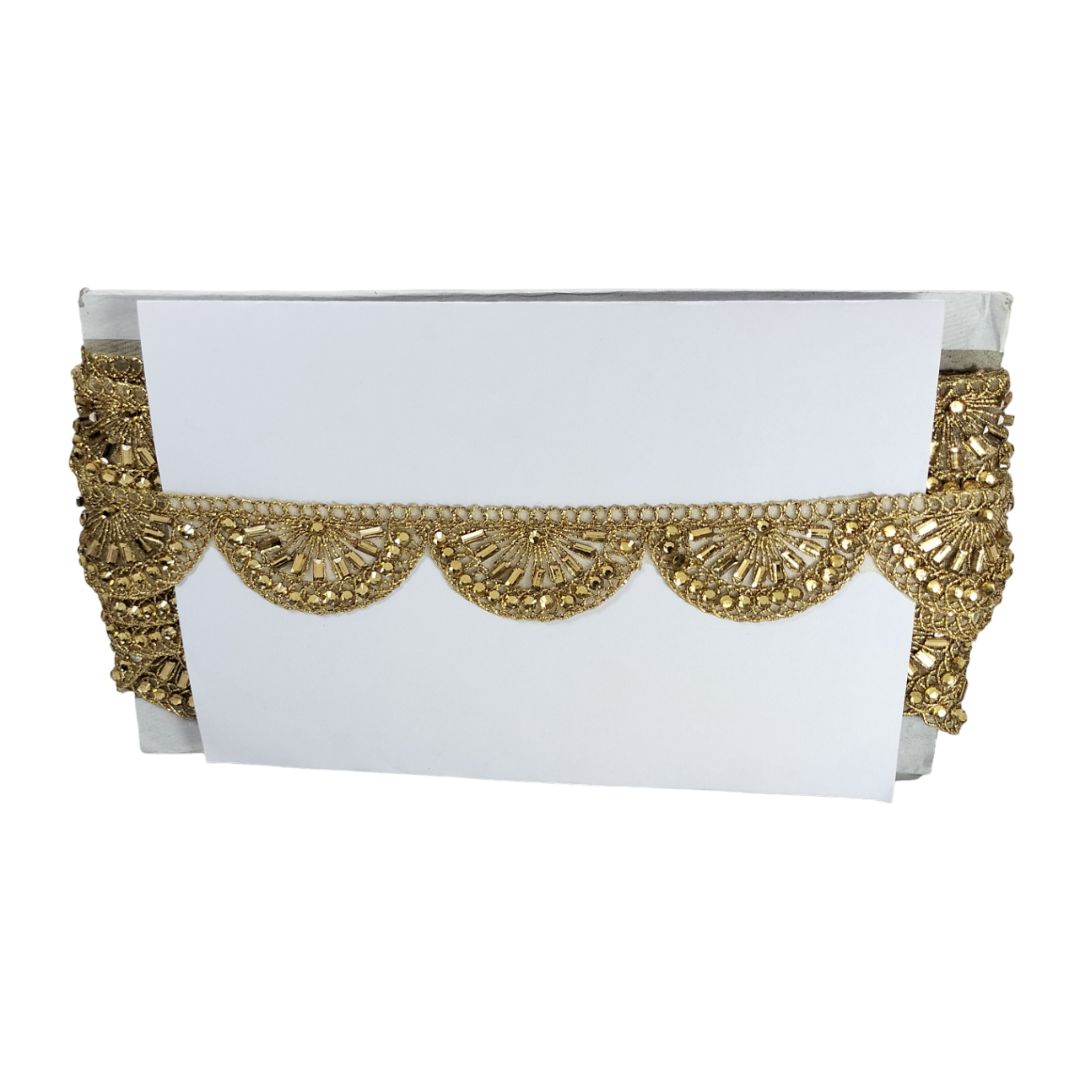 Decorative cornice with gold trim on a white background