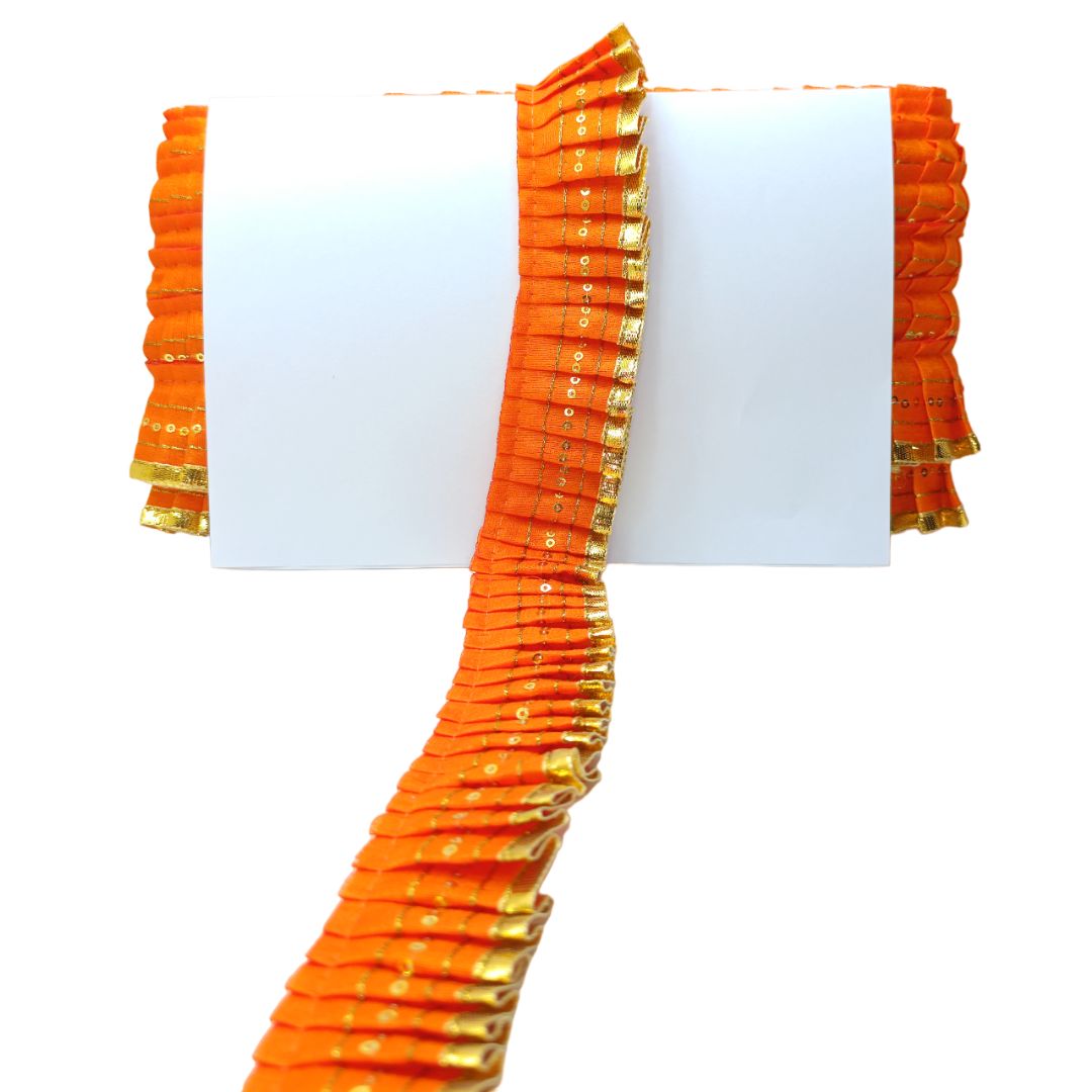 Orange saree with gold border on a white background