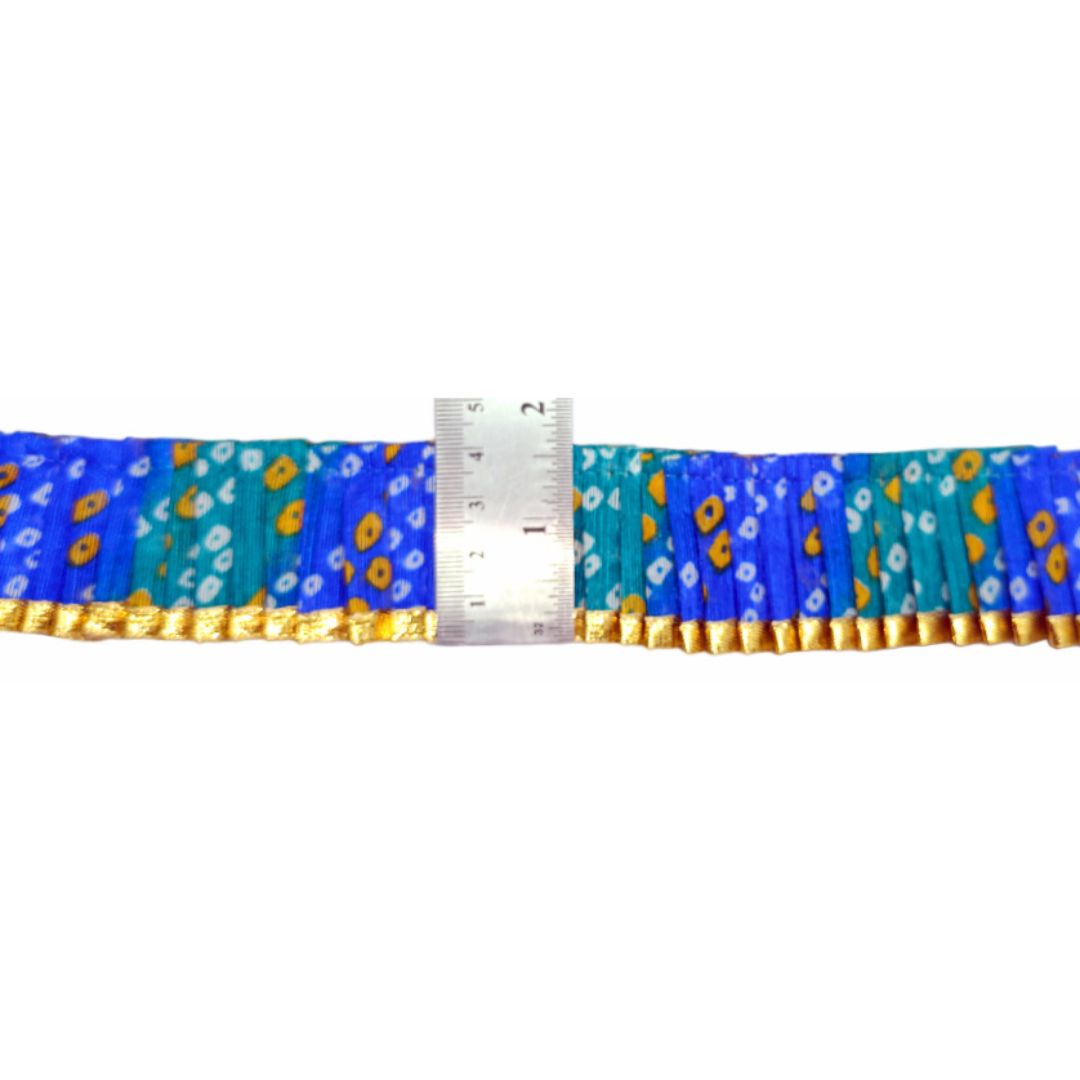 Blue floral-patterned belt with a ruler for size reference on a white background