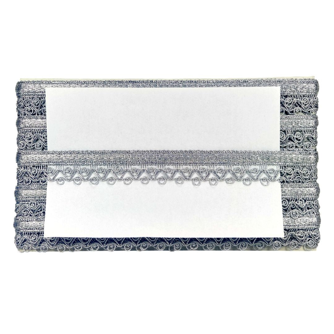 Decorative clutch with lace detailing on a white background