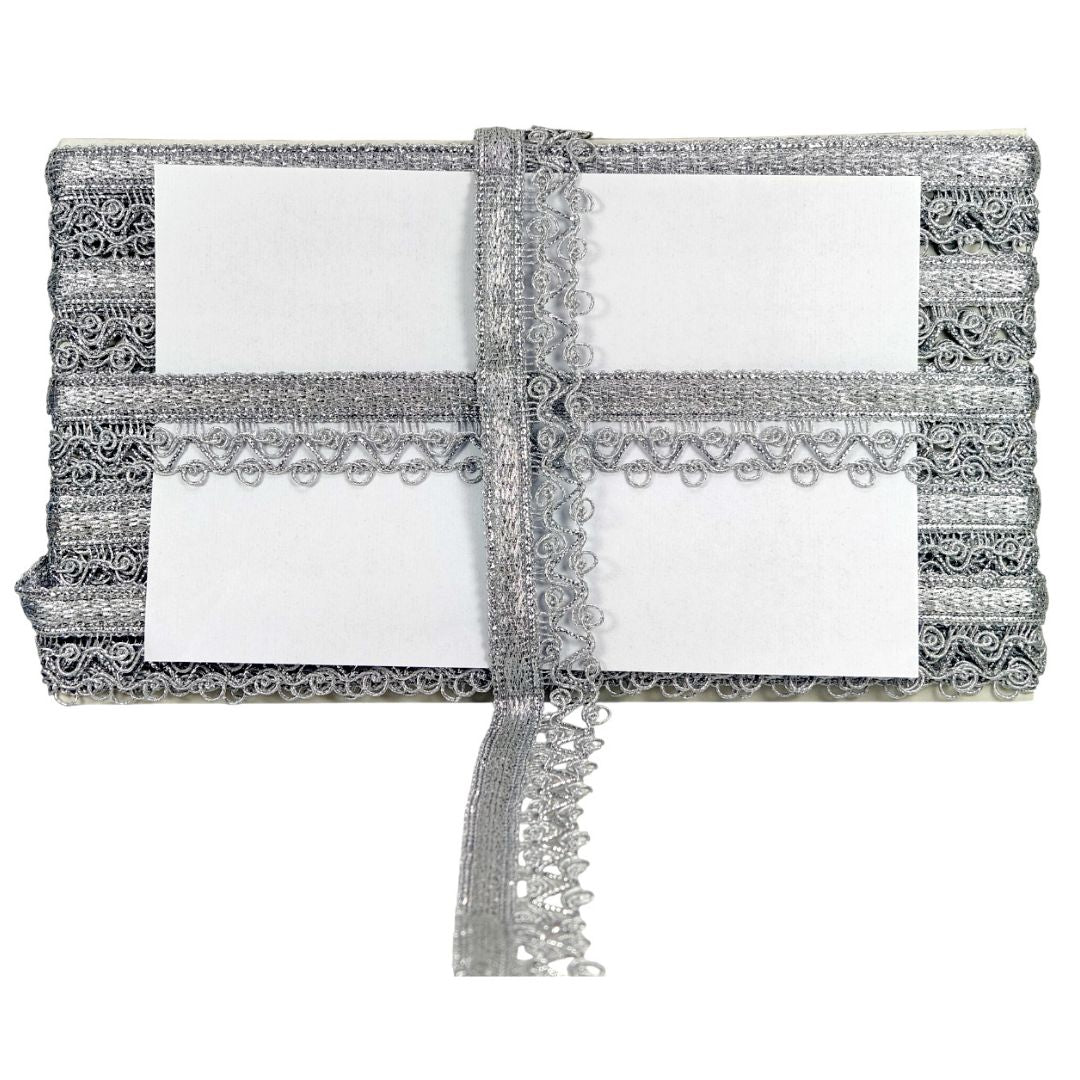 Set of silver lace-trimmed napkins on a white background