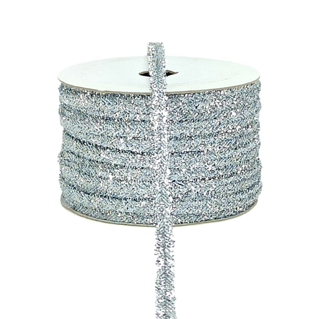 Spool of silver glitter ribbon on a white background