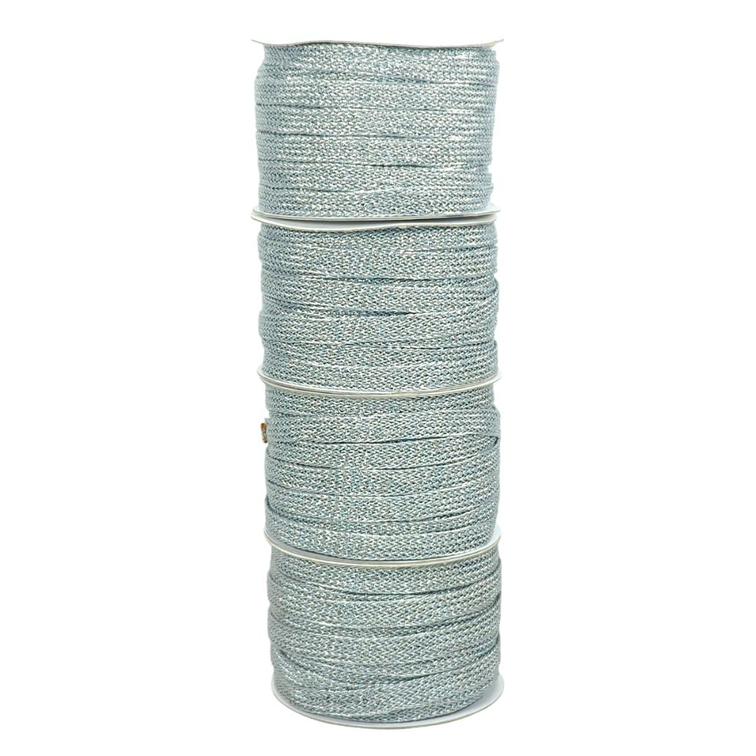 Spool of silver thread on a white background