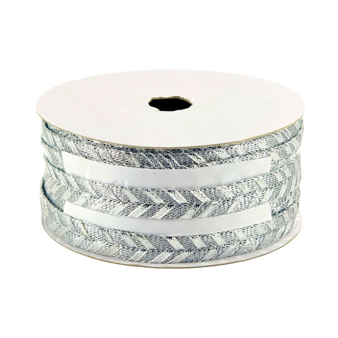 Spool of ribbon with a white and gray pattern on a white background
