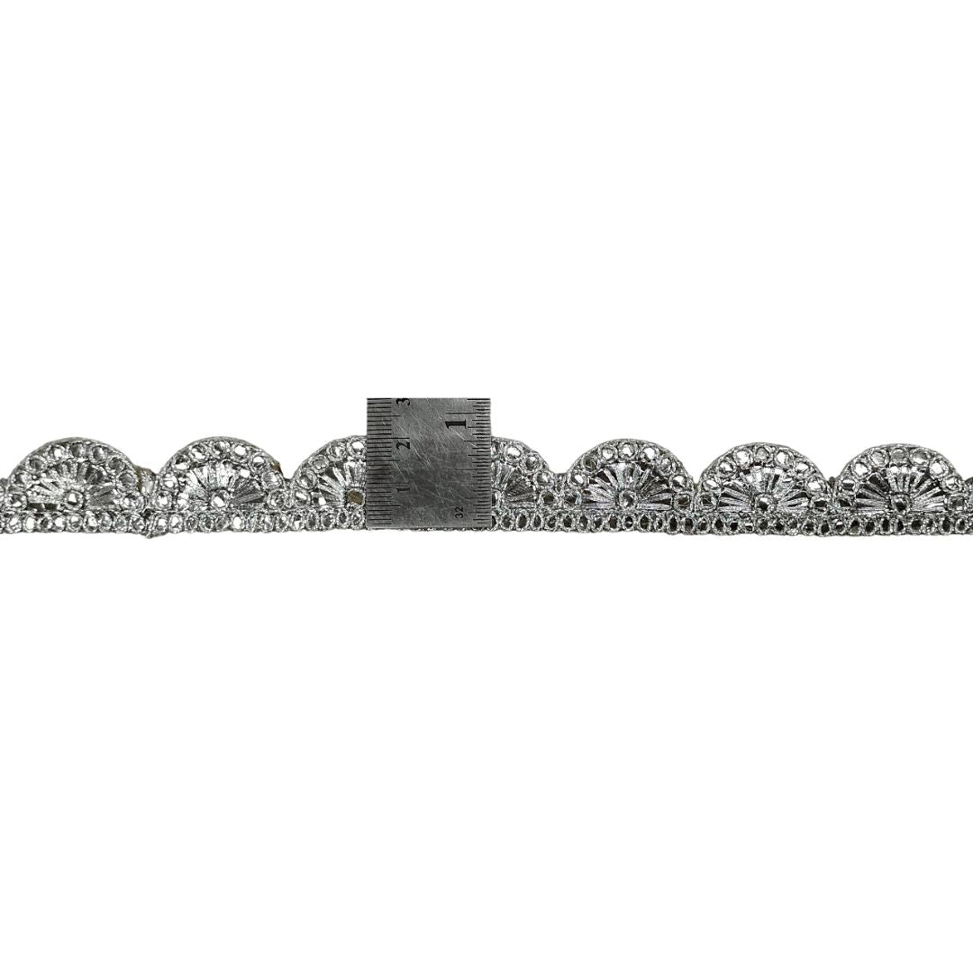 Silver bracelet with floral design on a white background