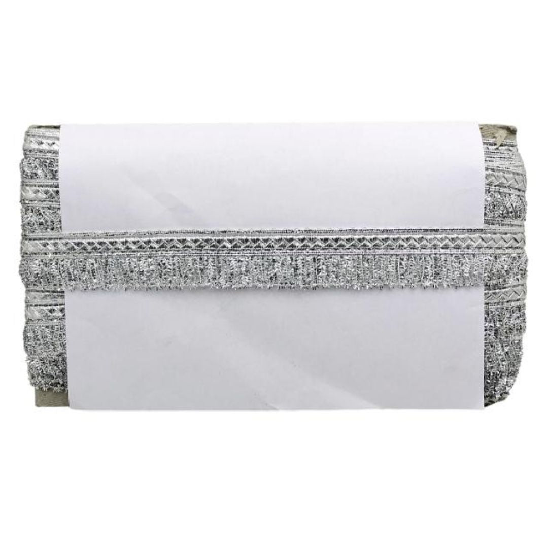 White clutch bag with silver glittery trim on a white background