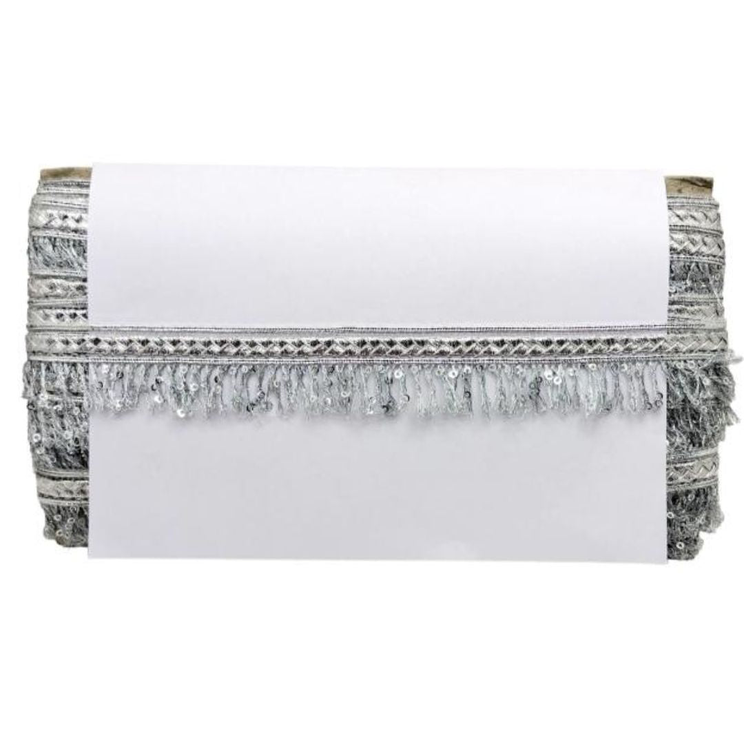 White clutch with silver fringe and embellishments on a white background