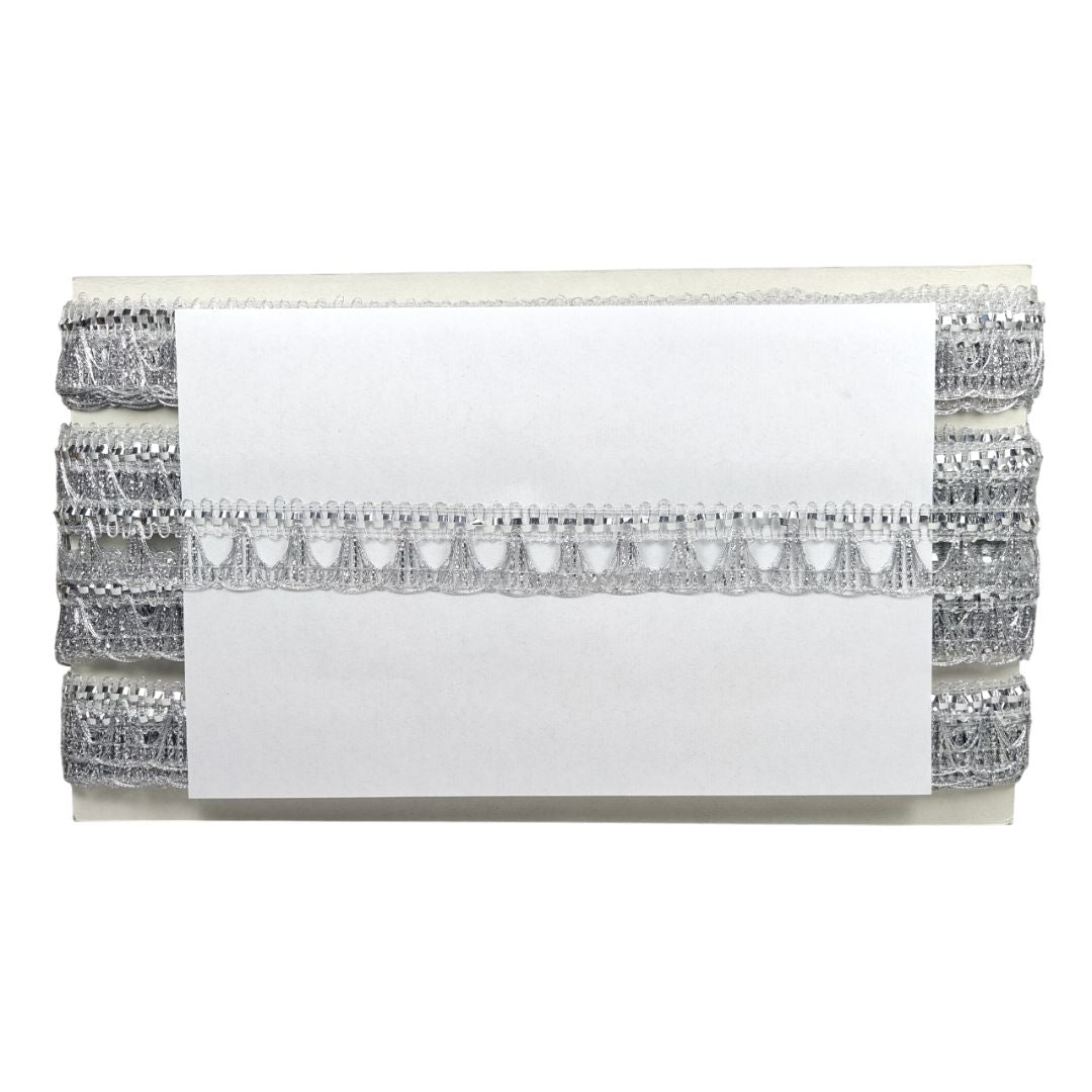 Silver clutch with decorative trim on a white background