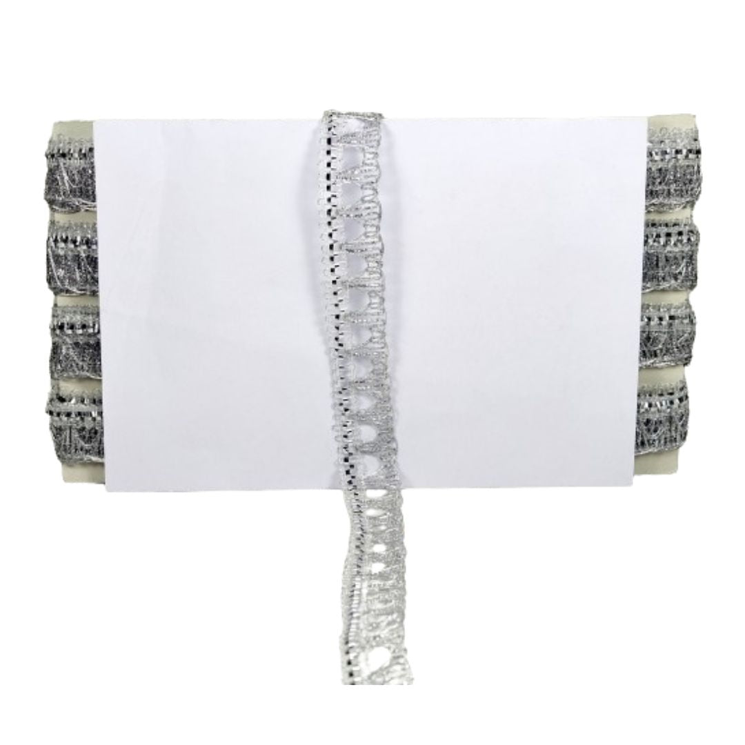 White clutch with decorative silver trim and patterned ends on a white background