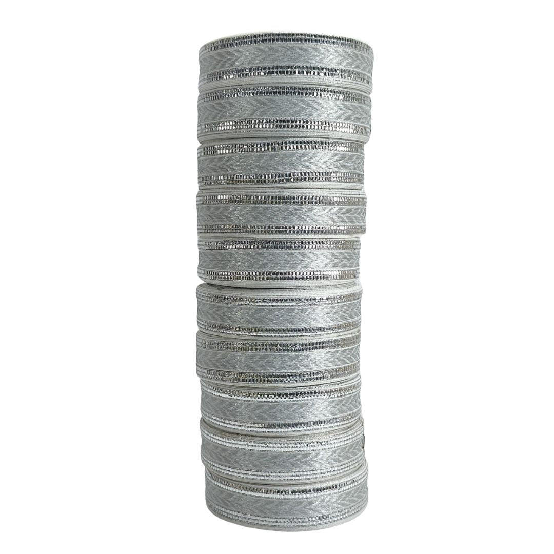 Stack of silver bangles on a white background