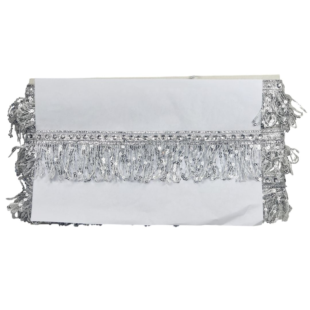 White clutch with silver fringe on a white background