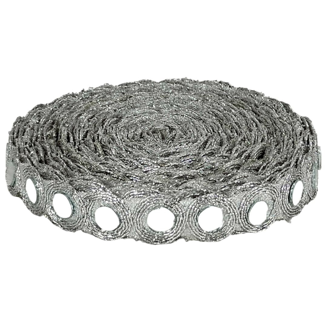 Metallic lace trim with circular cutouts on a white background