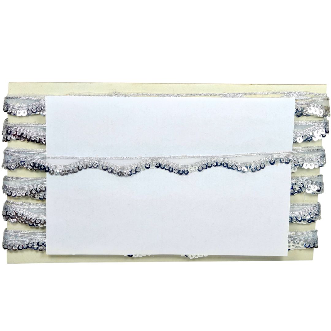 Stack of white cards with decorative ribbons on a white background