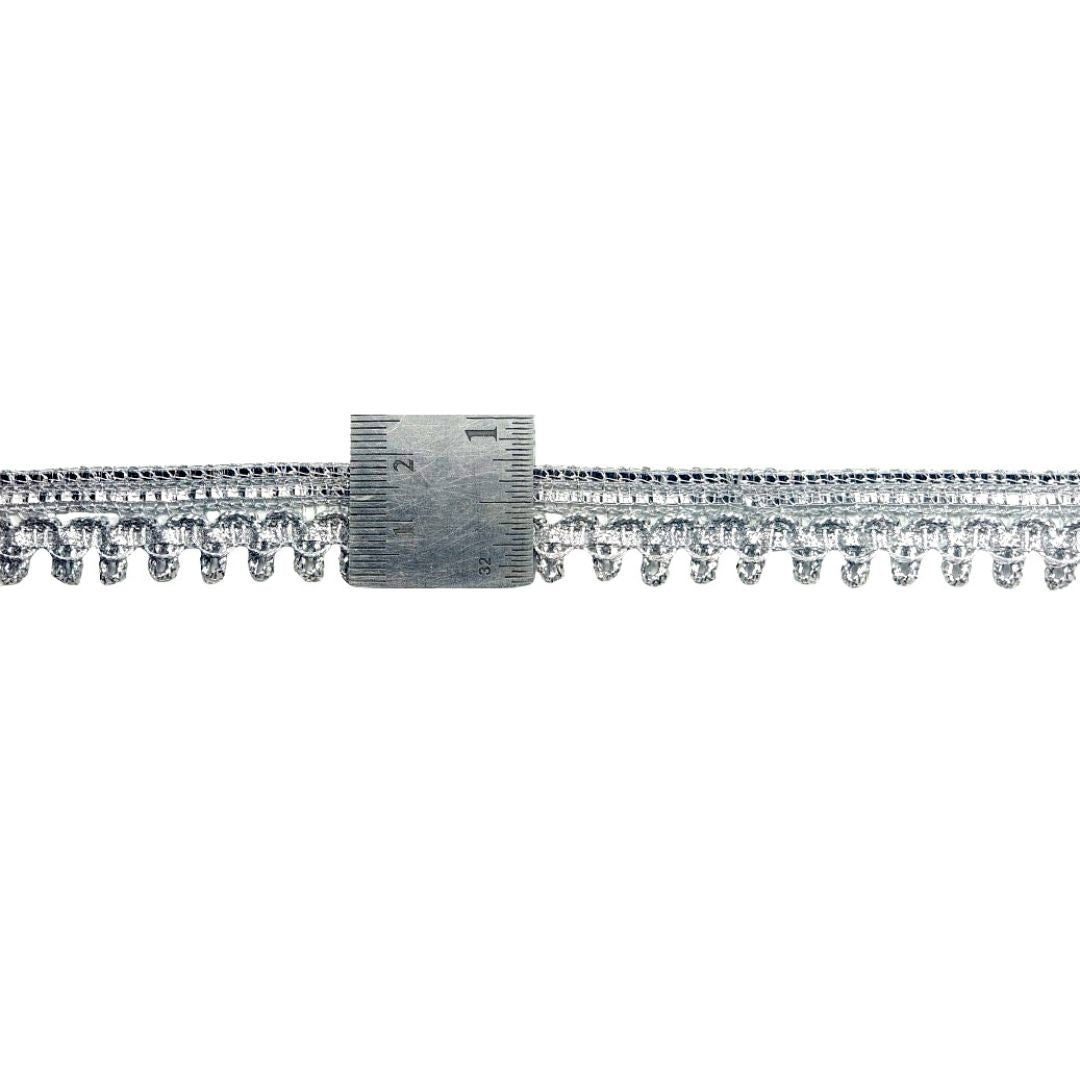 Silver bracelet with clear gemstones on a white background