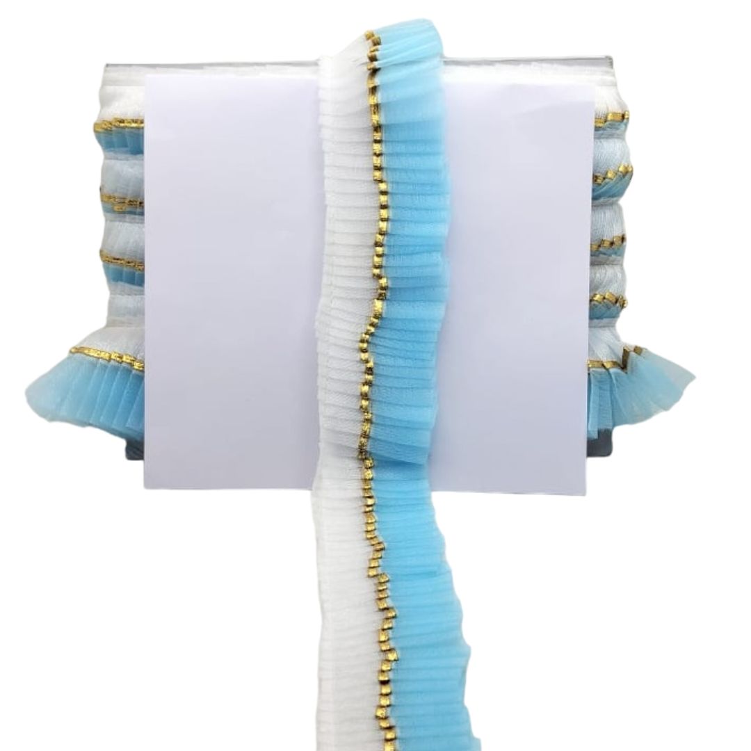 Stack of light blue and white books with gold accents on a white background