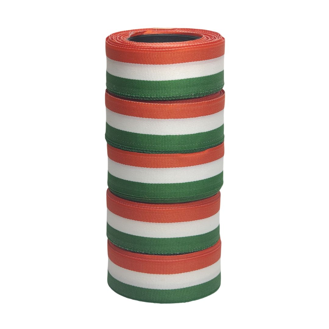 Stack of red, green, and white striped ribbons on a white background