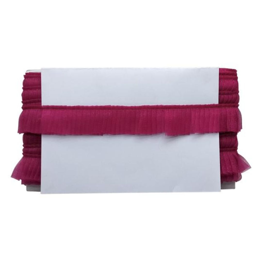 White clutch with red ruffled edge on a white background