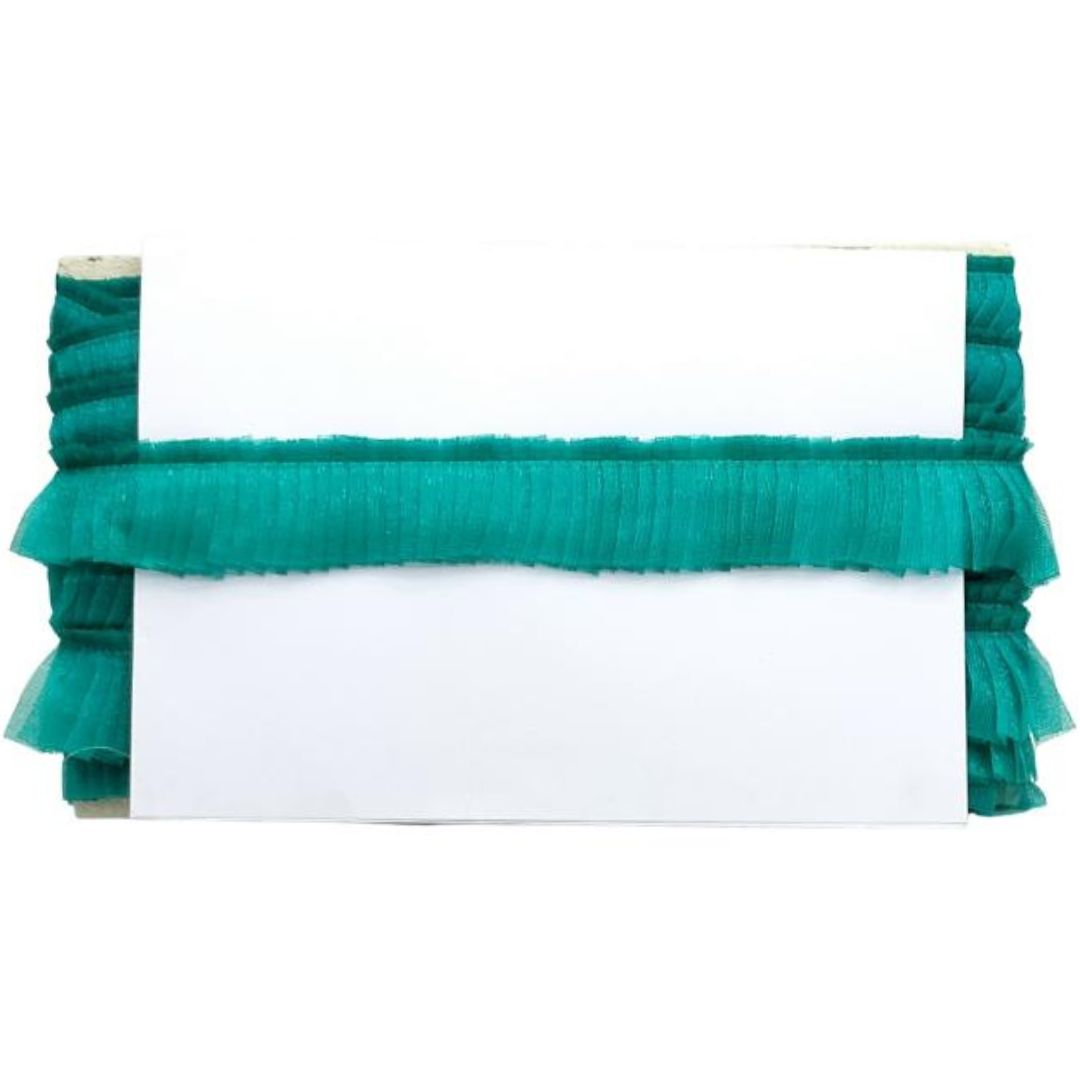 Green ruffled clutch bag on a white background