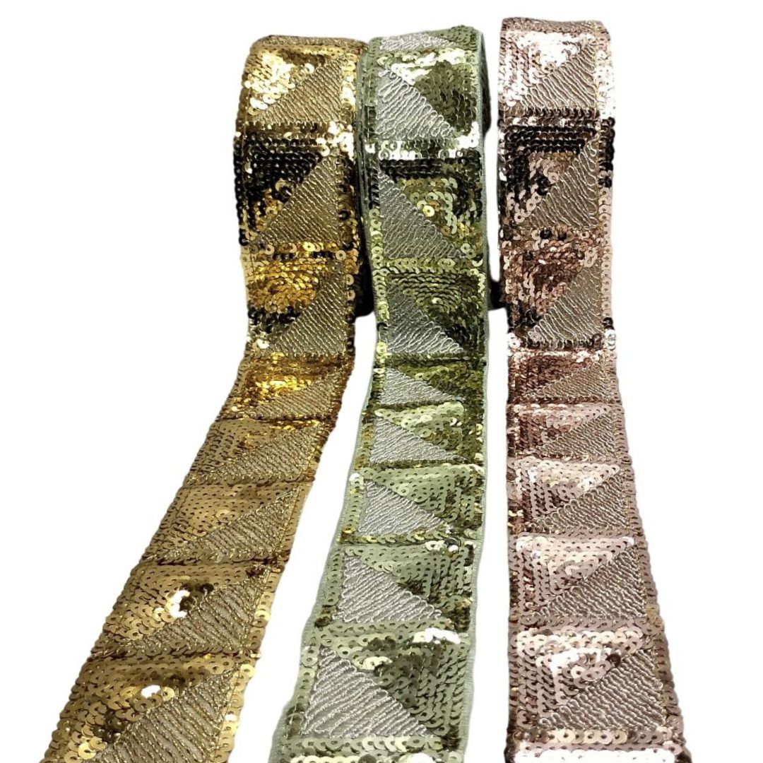 Three sequin ribbons in gold, green, and bronze on a white background