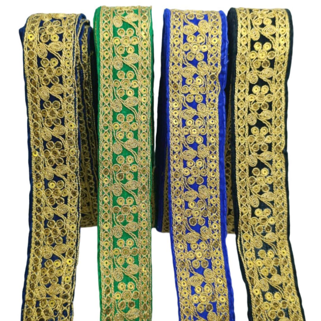 Four ribbons with gold embroidery on a white background