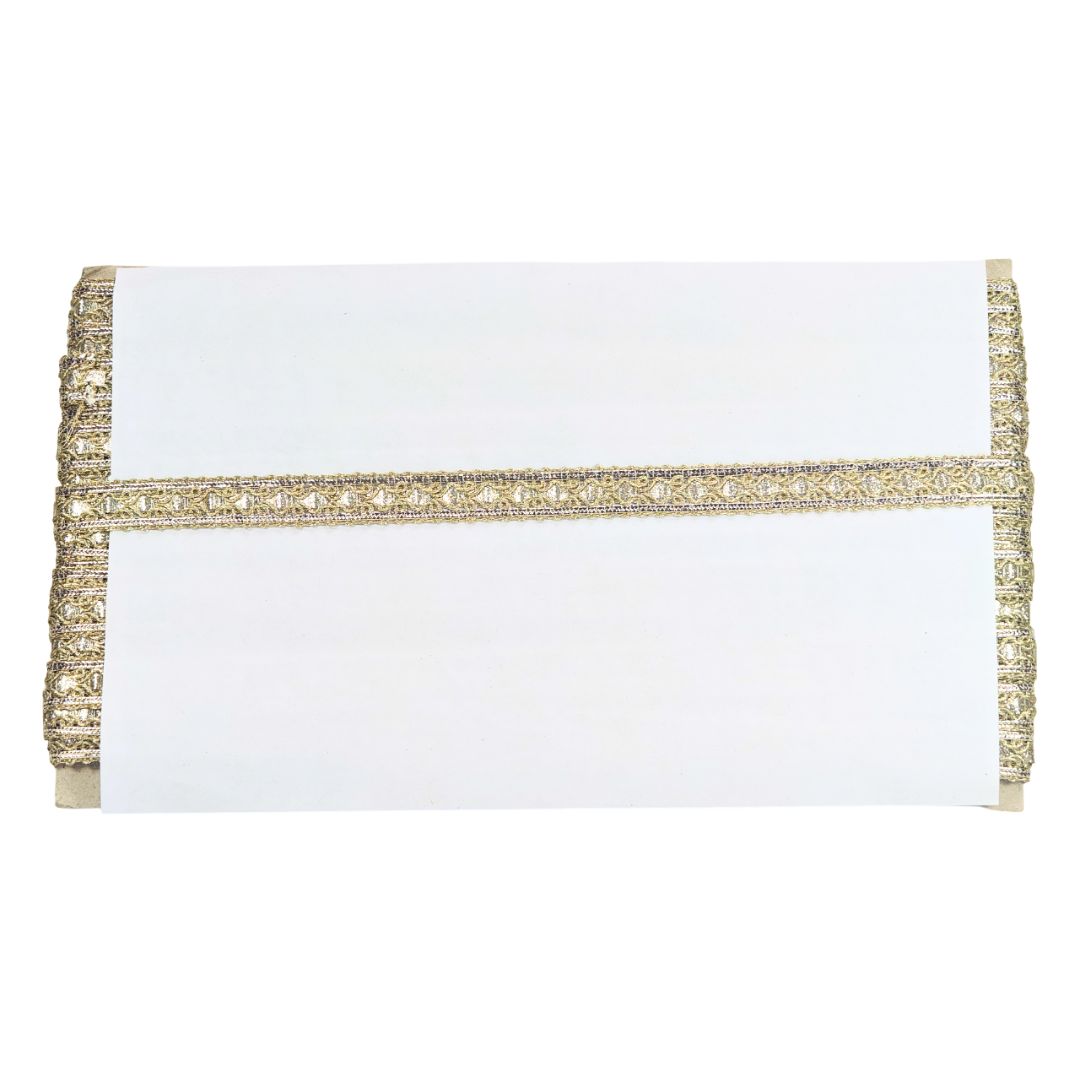 White clutch with gold trim on a white background