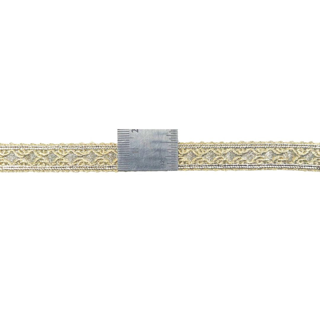 Decorative belt with gold and silver pattern on a white background