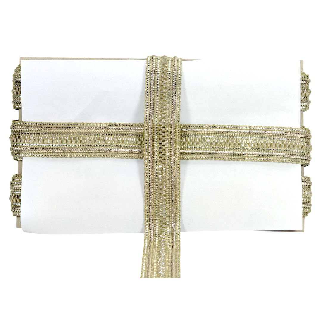 White clutch with gold beaded strap on a white background