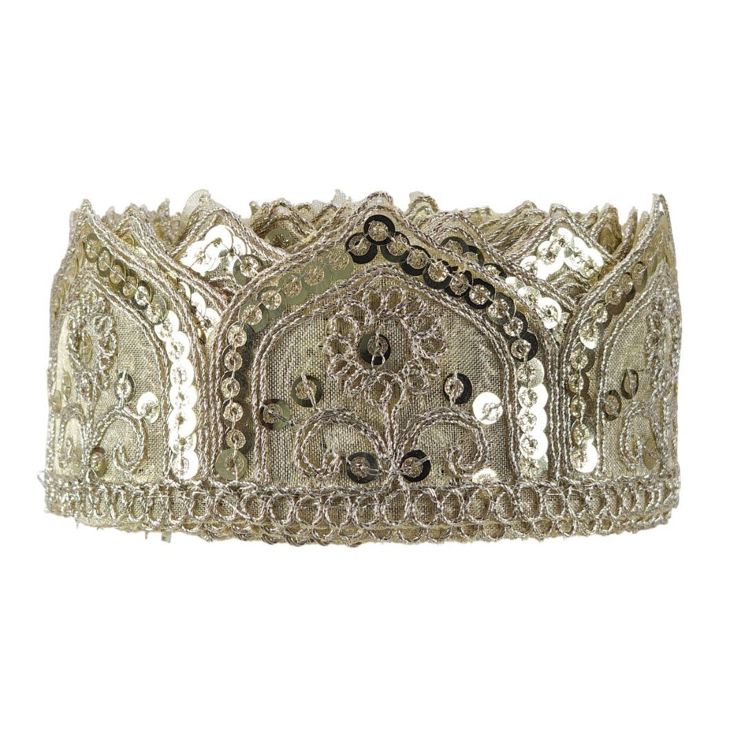 Decorative silver tiara with intricate patterns on a white background