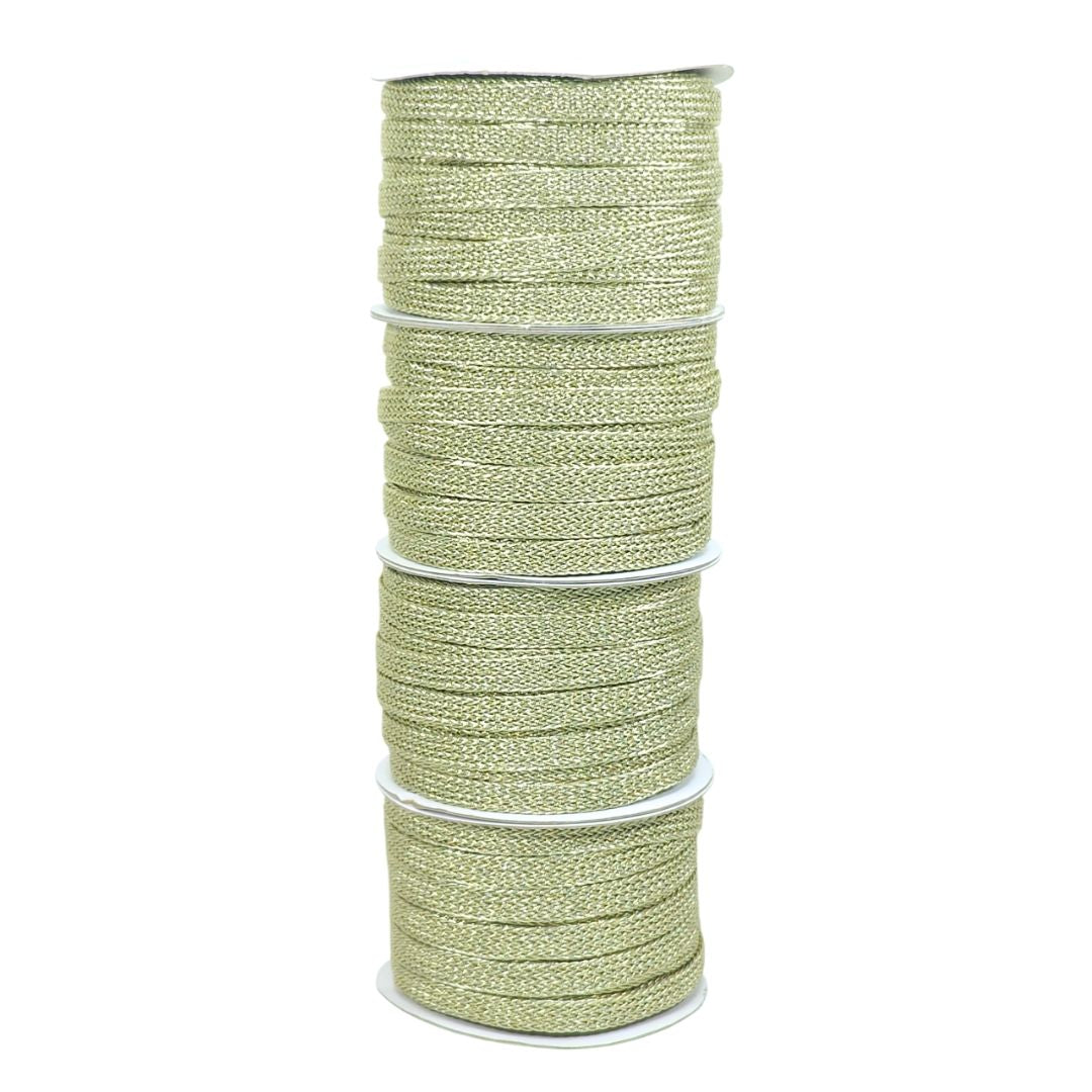 Spool of green thread on a white background