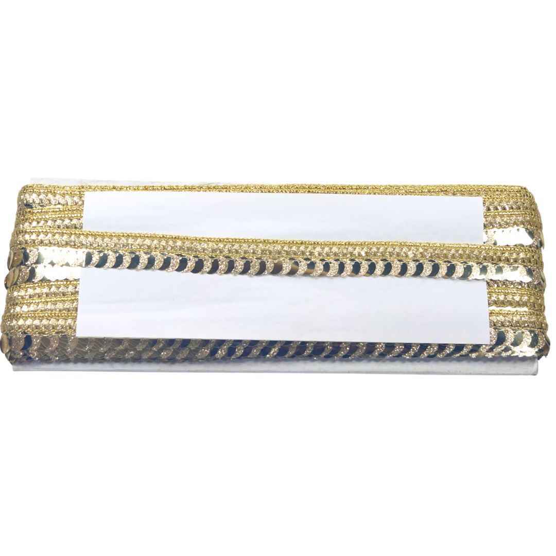Gold and black striped box with a white label on a white background