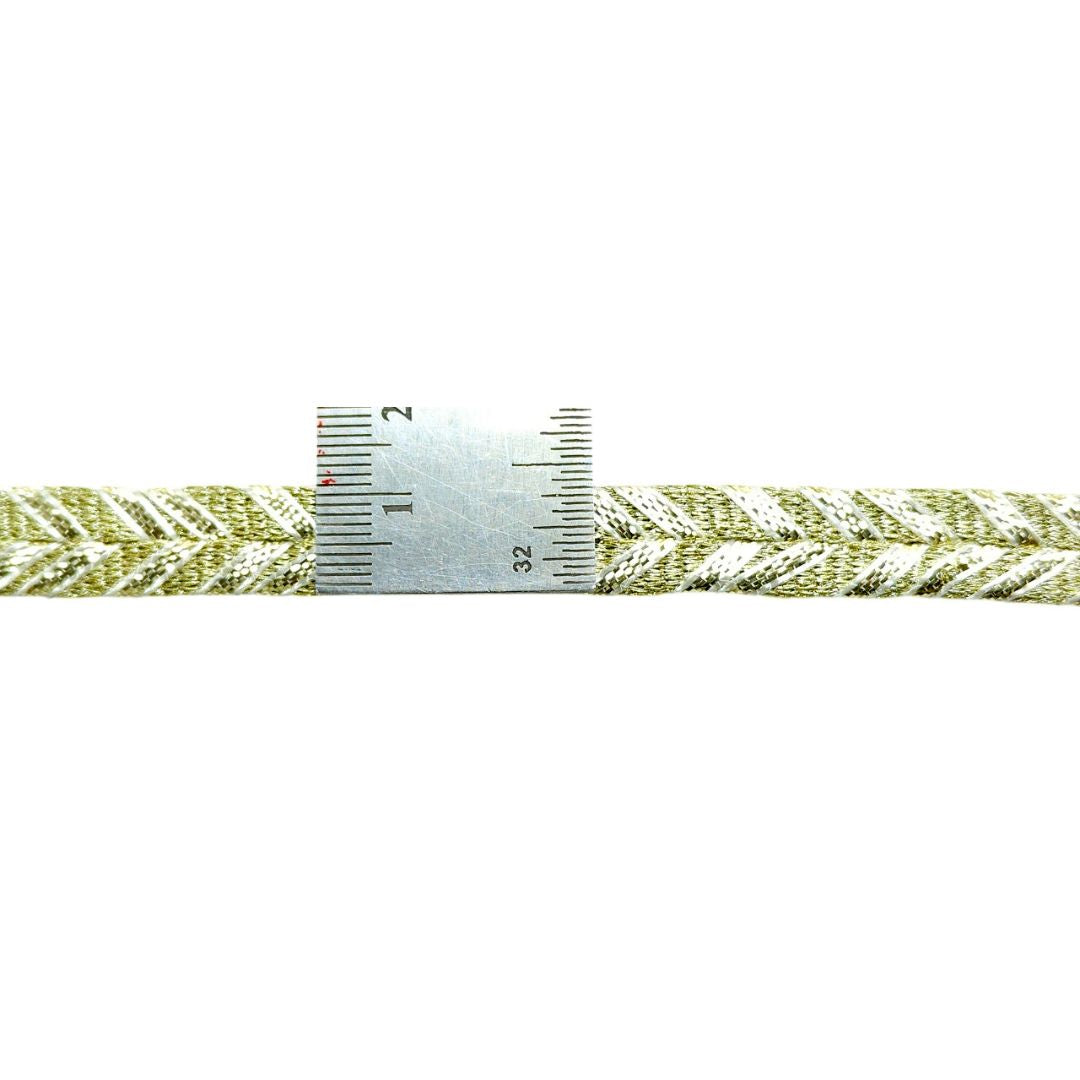 Green braided cord with a ruler for scale on a white background