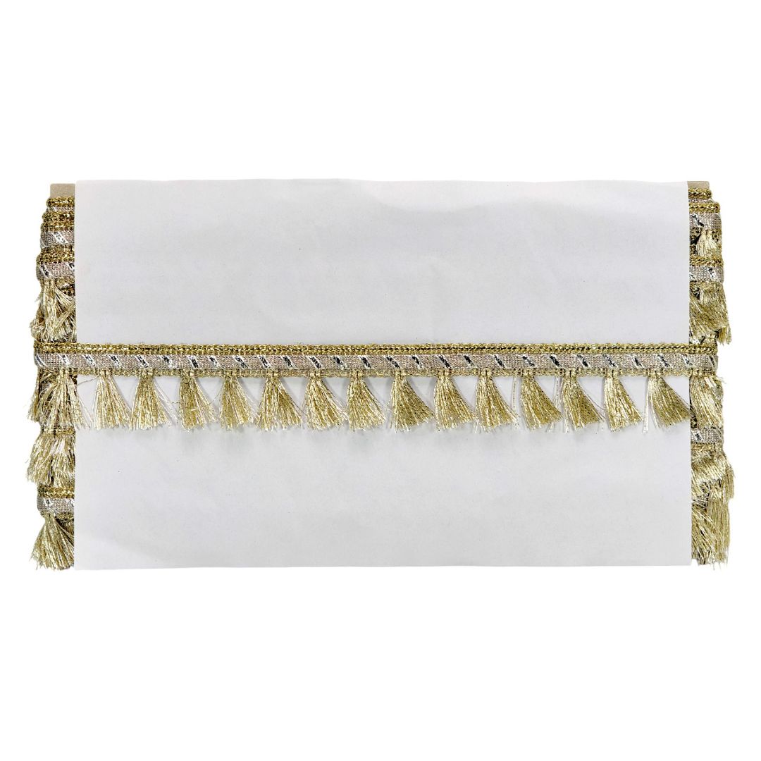 White clutch with gold tassel detailing on a white background