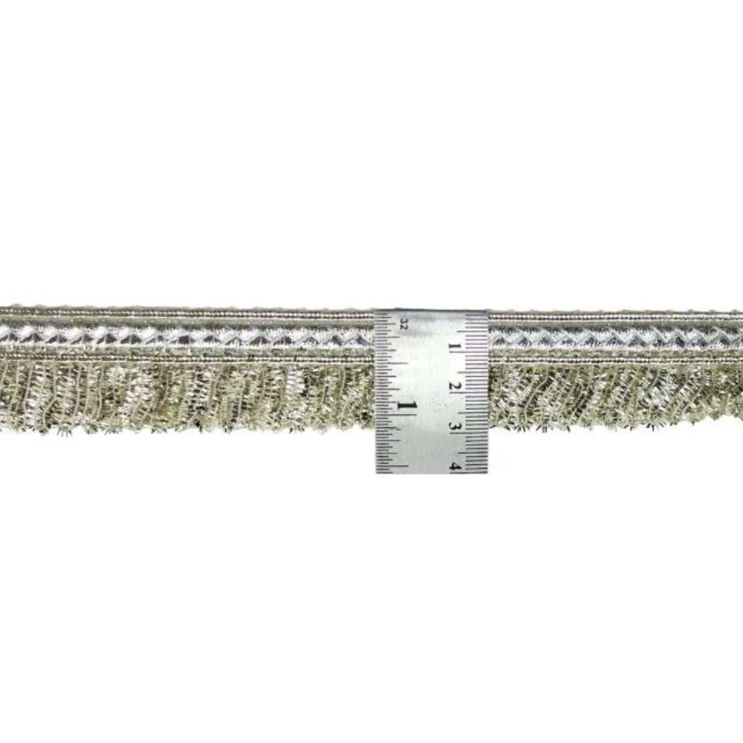 Decorative trim with a ruler for scale on a white background